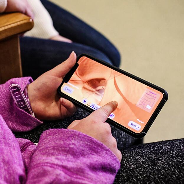 A child uses the Klick HealthVoyager app