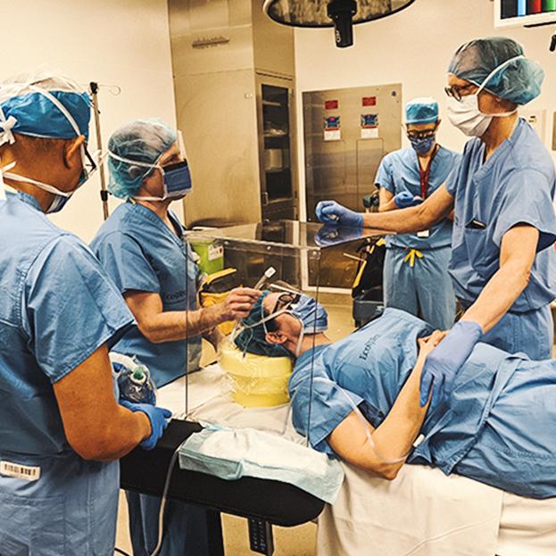 Doctors using the Klick intubation box
